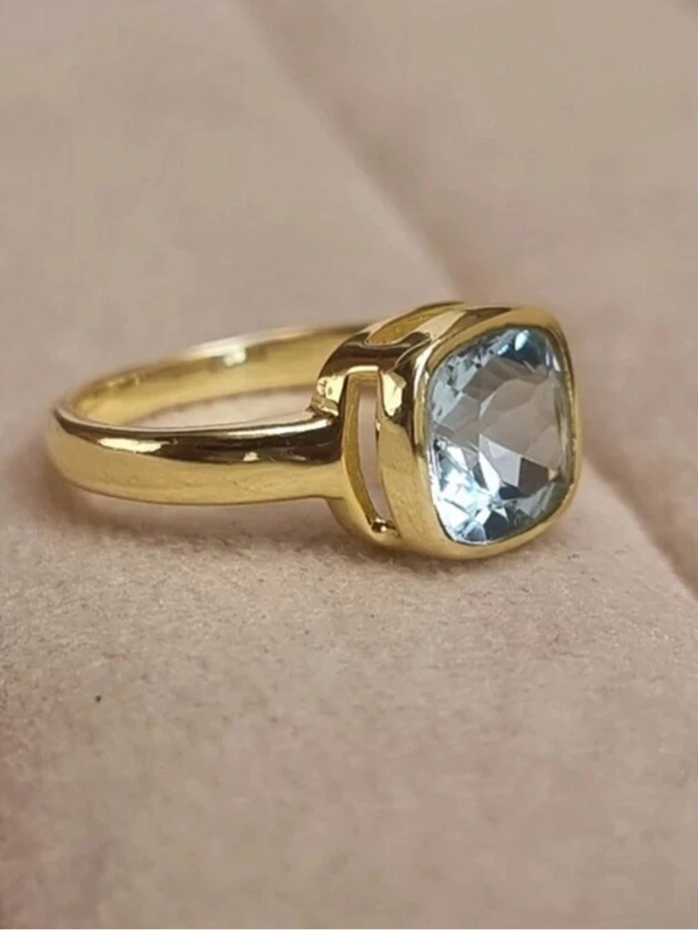 Gold Ring with Light Blue Zirconia Stone
